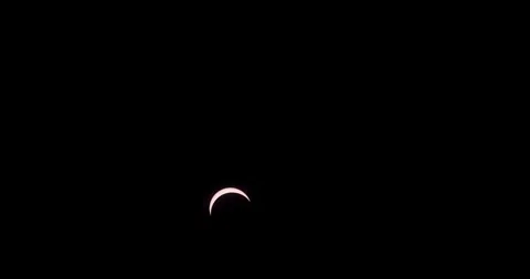 Partial Solar Eclipse Moves Across Black Sky in Timelapse Stock-Footage 347074145