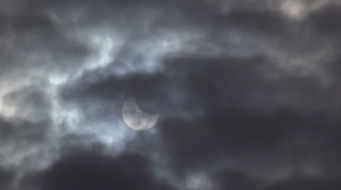 Partial Solar Eclipse Obscured by Heavy Clouds Stock Footage 42990364