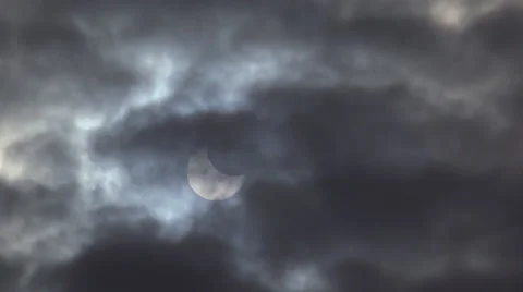 Partial Solar Eclipse Obscured by Heavy Clouds 4K Stock Footage 48517073