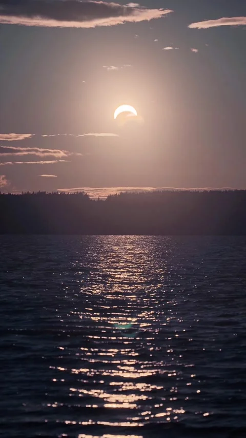 Partial Solar Eclipse over Lake in Kouvola, Finland Stock Footage 347473918