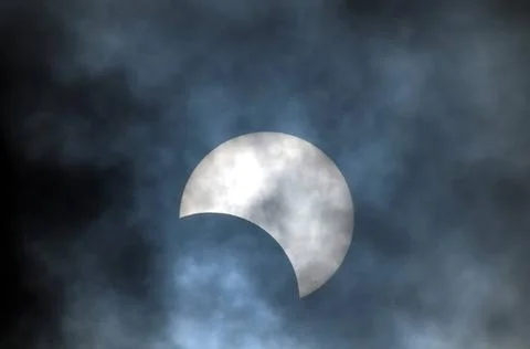 Partial Solar Eclipse Partial Solar Eclipse on a Cloudy Day 03.11.2013 Cop... Fotos Stock