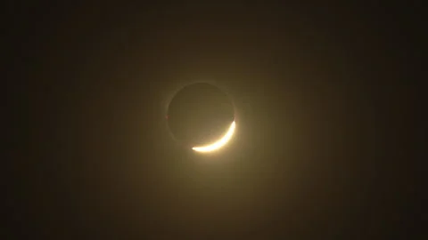 Partial Solar Eclipse Reopening After Totality in Sepia Light Stock Footage 345909548