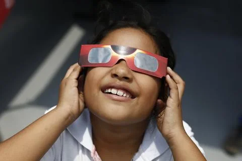 Partial solar eclipse seen in El Salvador, Soyapango - 08 Apr 2024 Stock Photos