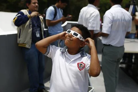 Partial solar eclipse seen in El Salvador, Soyapango - 08 Apr 2024 Stock Photos
