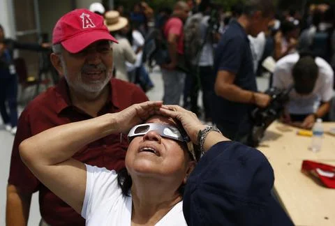 Partial solar eclipse seen in El Salvador, Soyapango - 08 Apr 2024 Stock Photos