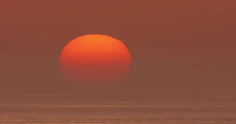 Partial solar eclipse sun, sunset sky time lapse nature over ocean sea timelapse Stock Footage 253459138