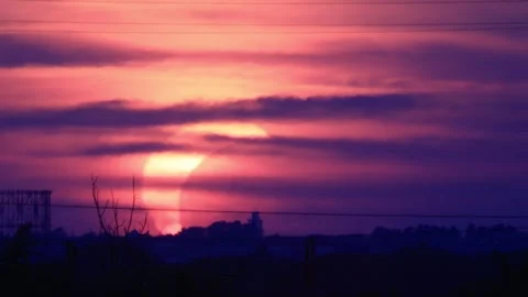 Partial solar eclipse at sunset over Rome skyline with Gasometer silhouette.. Stock Footage 342285579