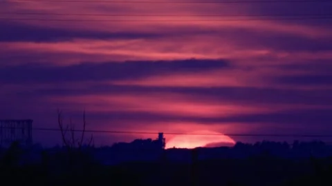 Partial solar eclipse at sunset over Rome skyline with Gasometer silhouette.. Stock Footage 342285783