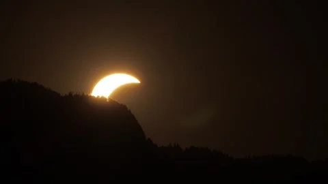 Partial Solar Eclipse at Sunset Over French Alps in 2026 Stock Footage 342347603