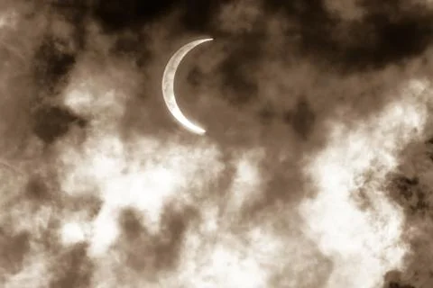 Partial Solar Eclipse Through Clouds Fotos Stock