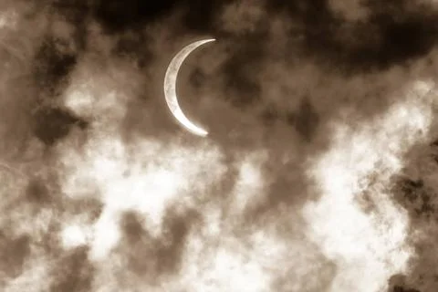  Partial Solar Eclipse Through Clouds Partial Solar Eclipse Through Clouds... Fotos Stock