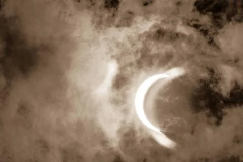  Partial Solar Eclipse Through Clouds Partial Solar Eclipse Through Clouds... Fotos Stock