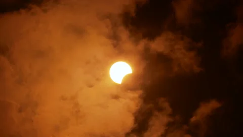 Partial solar eclipse viewed under cloudy skies. Stavropol on 21th June 2020 Stock Footage 133161294
