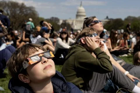 The partial solar eclipse in Washington, DC, USA - 08 Apr 2024 Stock Photos