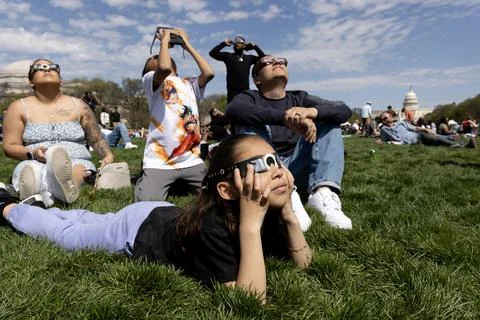 The partial solar eclipse in Washington, DC, USA - 08 Apr 2024 Stock Photos