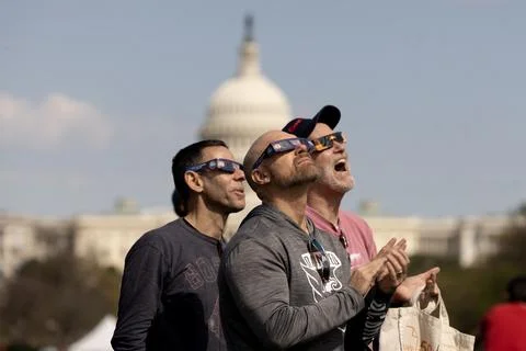 The partial solar eclipse in Washington, DC, USA - 08 Apr 2024 Stock Photos