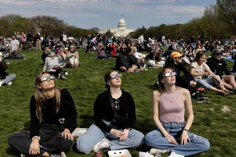 The partial solar eclipse in Washington, DC, USA - 08 Apr 2024 Stock Photos