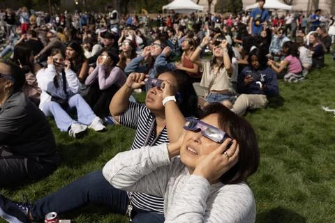 The partial solar eclipse in Washington, DC, USA - 08 Apr 2024 Stock Photos