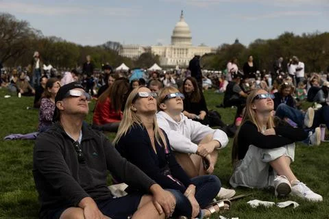 The partial solar eclipse in Washington, DC, USA - 08 Apr 2024 Stock Photos