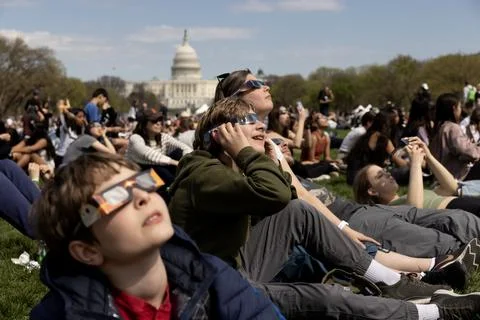 The partial solar eclipse in Washington, DC, USA - 08 Apr 2024 Stock Photos