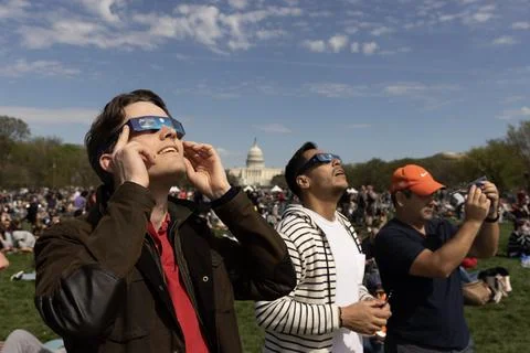 The partial solar eclipse in Washington, DC, USA - 08 Apr 2024 Stock Photos