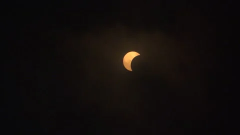 Partial Solor Eclipse Seen Through Clouds April 8 2024 - 03 Stock Footage 271443681
