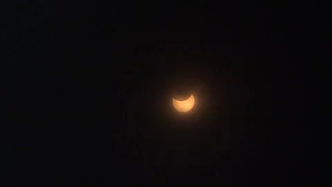 Partial Solor Eclipse Seen Through Clouds April 8 2024 - 04 Stock Footage 271444293