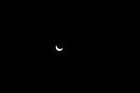 Partial sun eclipse. Close-up Sun on dark background Stock Photos