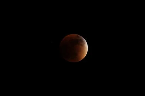 Partial before total lunar eclipse 2015 Stock Photos