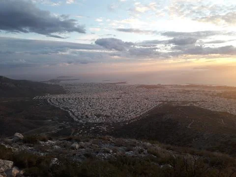 Partial view of Athens' suburbs from a mountainside at dusk, Greece Stock Photos