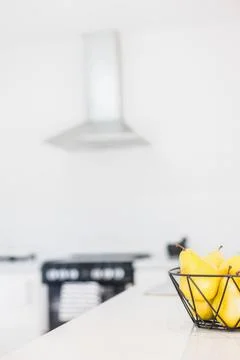 Partial View of a Basket of Pears on a Kitchen Counter Stock Photos