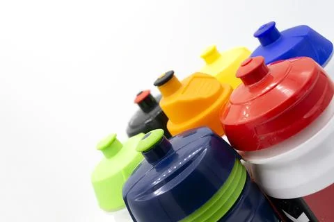 Partial view of cycling bottles without trademark of different colors diago.. Stock Photos