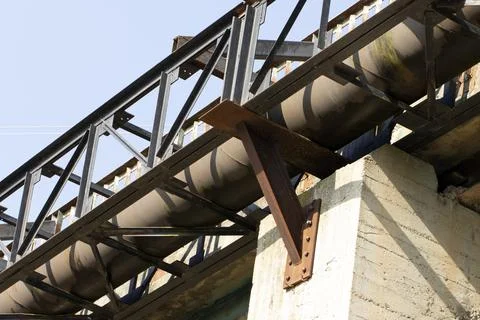 Partial view of a drinking water pipeline fixed on a bridge Stock Photos