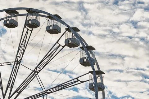Partial View of Ferris Wheel Against Cloudy Sky in Harrogate, UK Stock Photos