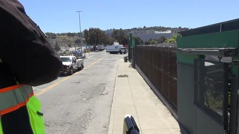 Partial view of Foreman riding the Train, train crossing San Francisco street Stock Footage 123387286