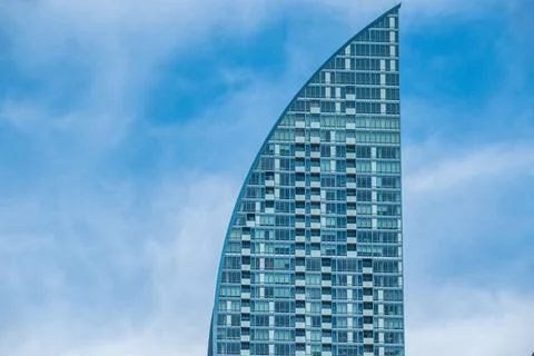 Partial view of the L Tower against blue cloudy sky Stock Photos