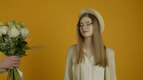 Partial view of man presenting roses to excited girl 動画素材 125481418