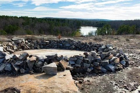 Partial view of a mysterious stone circle on granite with a lake behind Atl.. Foto stock