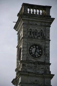 Partial view of the old Dutch Clock Tower against cloudy sky in Matara, Sri Stock Photos