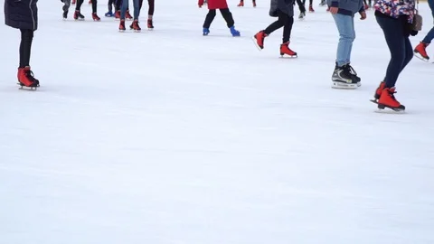 Partial view of people skating on ice rink in winter Stock Footage 101687542