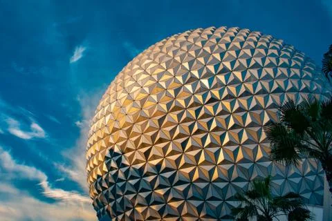 Partial view of Sphere Spaceship Earth attraction on blue cloudy sky Stock Photos