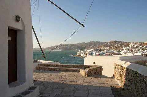 Partial view of a windmill and panoramic view of Mykonos Stock Photos