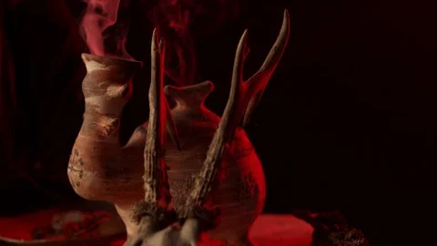 Partial view of witch with knife and steaming vessel 스톡 동영상 125838509