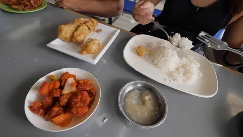Partial view of a woman eating on the table in an Asian restaurant. Stock Footage 115804448