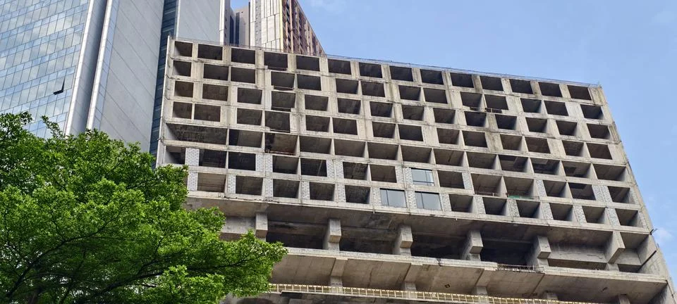 Partially constructed concrete building with a grid of square openings Stock Photos