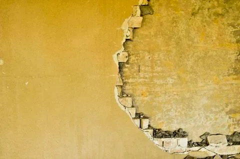 Partially destroyed wall inside an industrial building under demolition Stock-Fotos