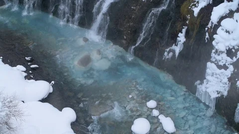 Partially frozen Shirahige waterfall under snowfall, Hokkaido, Japan Stock Footage 102261753