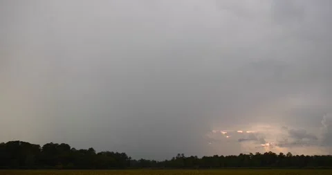 Partially obscured lightning strike over dark ominous sunset Stock Footage 137427191