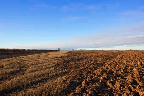Partially plowed field Stock Photos