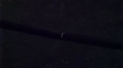 Partially severed electrical cords with sparks and smoke Stock Footage 59525860